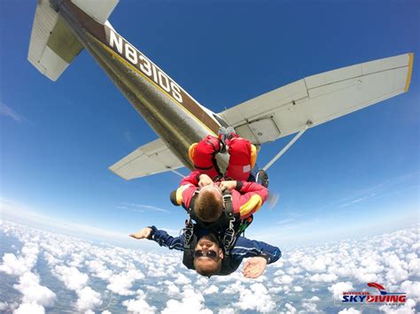 Jumping Out Of A Plane Upside Down Above The Clouds At Wisconsin