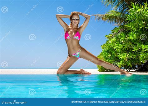 Woman In Bikini Near The Pool At Maldives Tropical Island Elegant