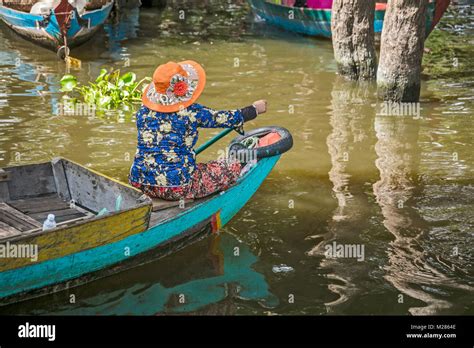 Cambodian Women Waiting In Boats To Take Tourists To Mangrove Swamps