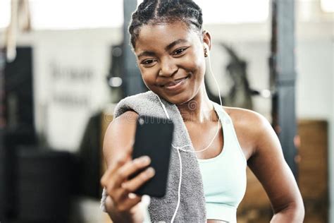 A Gym Selfie For Social Media An Attractive Young Woman Standing Alone