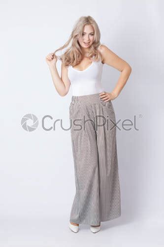 Full Length Portrait Of Cheerful Blonde Woman Stock Photo Crushpixel