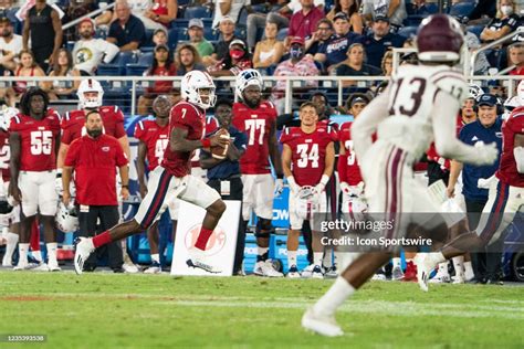 Florida Atlantic University quarterback NKosi Perry scrambles out of... News Photo - Getty Images