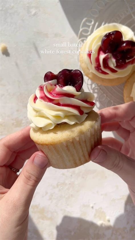 Vanilla Cupcakes With Cherry Jam And White Chocolate Buttercream From