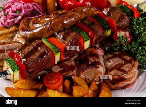 Grilled Pork And Vegetables Barbeque Stock Photo Alamy