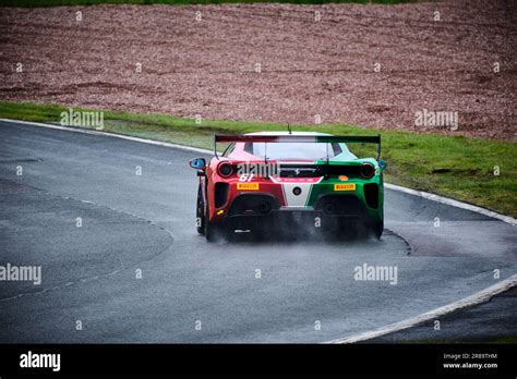 Ferrari Challenge Race Car Cornering During Qualifying On A Damp Oulton