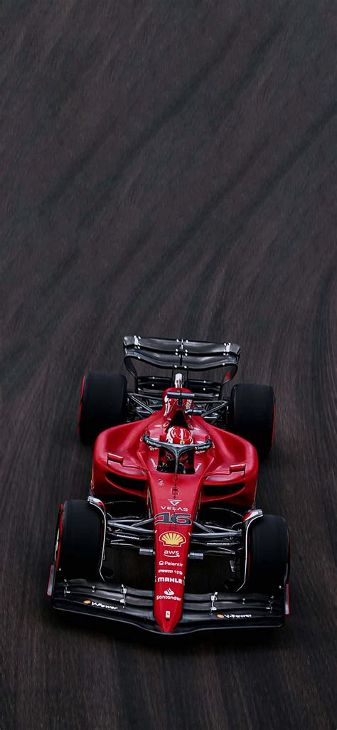 Download A Red Racing Car Wallpaper | Wallpapers.com