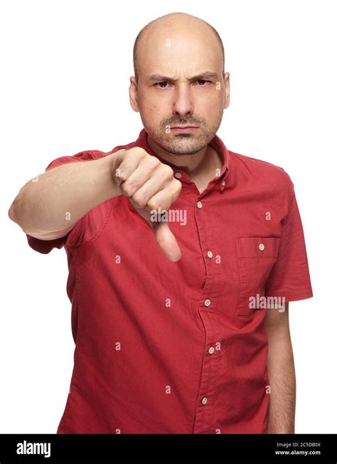 Angry Middle Aged Bald Man Shows His Thumb Down Isolated On White