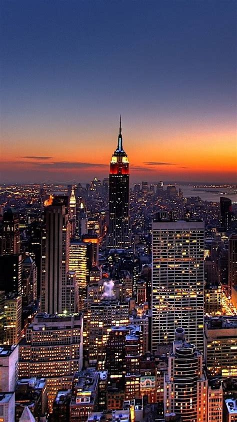 Download The Breathtaking Sunset Above The Iconic Empire State Building