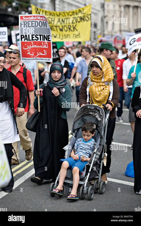 Two Women Dressed In Islamic Attire At A Demonstration Against The