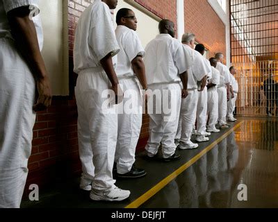 Male inmates at the Darrington Unit near Houston, Texas line up inside prison to attend event ...