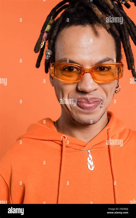 Portrait Of Satisfied Multiracial Man With Dreadlocks Wearing Stylish