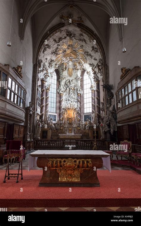 St. Michael's Church (German: Michaelerkirche) interior in Vienna, Austria, high altar with Fall ...