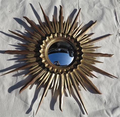 Miroir soleil convexe cadre bois doré feuilles d or 78 cm de diamétre