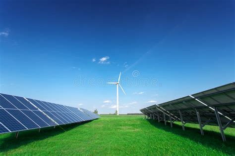 Windmill And Solar Panels On Blue Sky At Daytime Stock Image Image Of