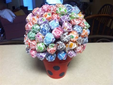 Dum Dums Stuck To A Styrofoam Ball Glued To A Small Clay Flower Pot