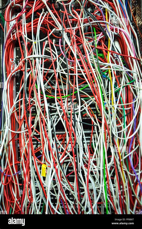 A Large Mass Of Multi Colored Computer Cables In A Server Room In A British Business Office In