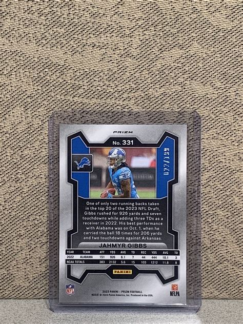 2023 Panini Prizm Rookies Blue Wave Prizm 331 Jahmyr Gibbs 199 RC