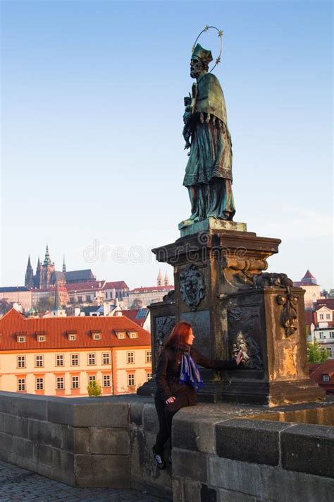 Beautiful Young Woman Is Touching The Bronze Plaque On Charles Bridge For Good Luck Prague