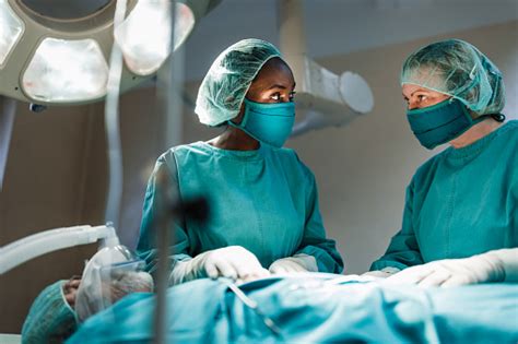 Black Female Surgeon At Work Stock Photo - Download Image Now - African ...