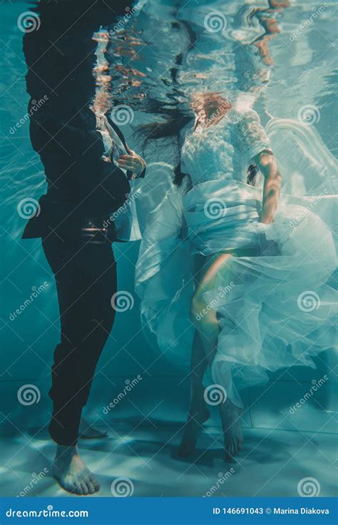 Beautiful Romantic Couple Of Bride And Groom After Wedding Swimming