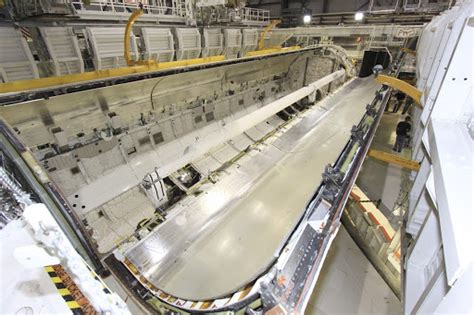 One Of Space Shuttle Atlantis Payload Bay Doors Is Opened By The Yellow