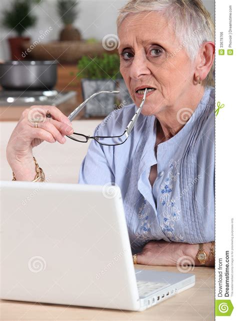 Confused Old Lady With Laptop Royalty Free Stock Image - Image: 33679766