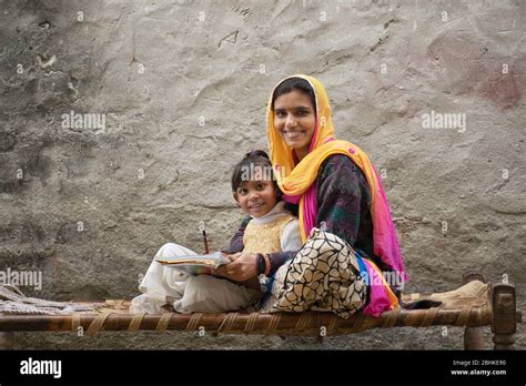 happy indian mother and daughter, mother helping her daughter in study Stock Photo - Alamy