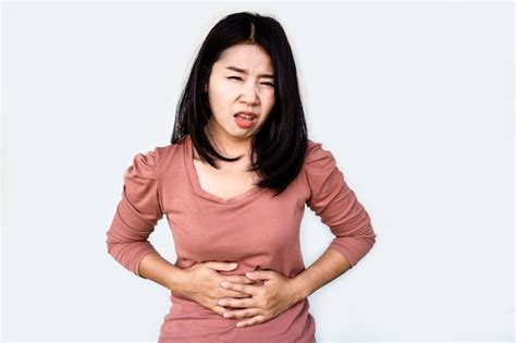 Premium Photo Asian Woman Suffering From Stomach Pain Hand Holding