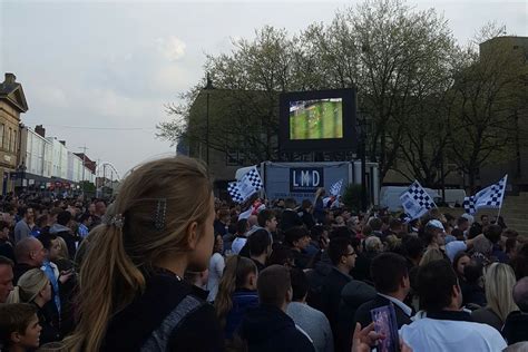 Bolton Wanderers Fans Celebrate Promotion In The Town Centre Lion Of