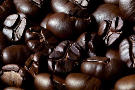 Premium AI Image Closeup Of Roasted Dark Coffee Beans