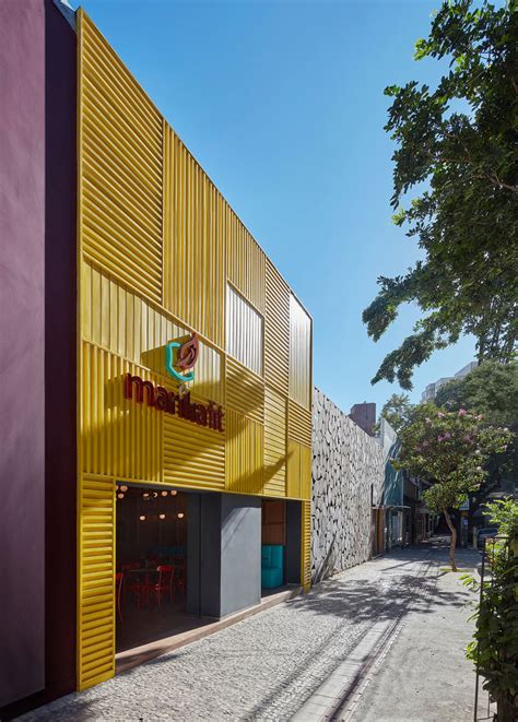 The Facade Of This New Restaurant Is A Bold Grid Of Yellow Aluminum