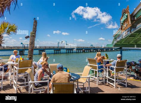 People enjoying summer day at Beaches at Vilano waterfront outdoor ...