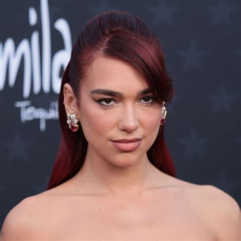 Dua Lipa Flaunts Her Incredible Curves In A Red Hot Floral Dress For