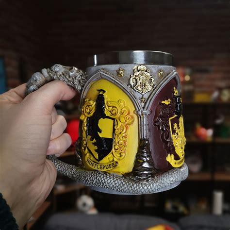 Harry Potter Cruche Avec Blason Des Maisons De Poudlard Elbenwald