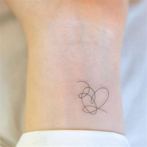 Fine Line Bts Heart Tattoo On The Wrist Discreet Tattoos Small