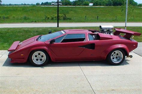 Side View Of An Impressive Looking Lamborghini Countach With A Massive