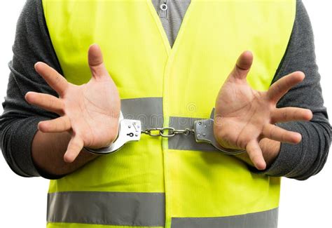 close   builder thief wearing work vest  handcuffs stock image