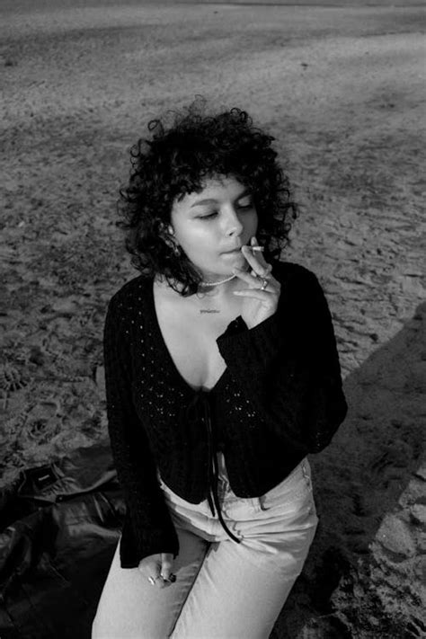 Black and White Photo of Woman Smoking Cigarette · Free Stock Photo