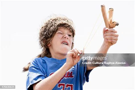 Boy With Slingshot Photos And Premium High Res Pictures Getty Images