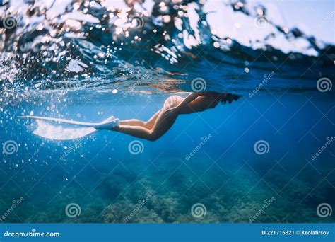 Naked Slim Woman With Freediving Fins Swimming In Blue Ocean Stock