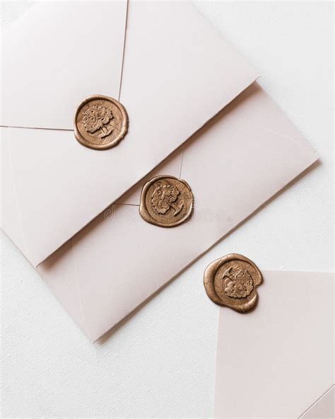 Closeup Of Wedding Envelopes With Wax Seals On A White Background Stock