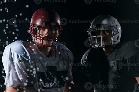 two american football players face to face in silhouette shadow on ...