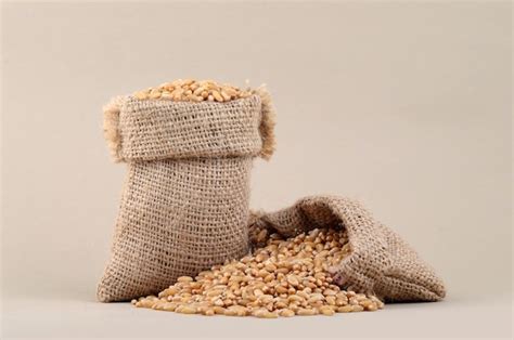 Premium Photo Wheat In Small Sack On Background Close Up