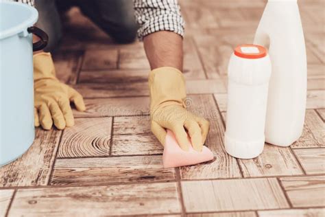 Man In Rubber Gloves With Washcloth Cleaning Floor Stock Photo Image