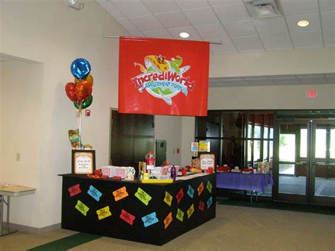 an office decorated with balloons, signs and decorations