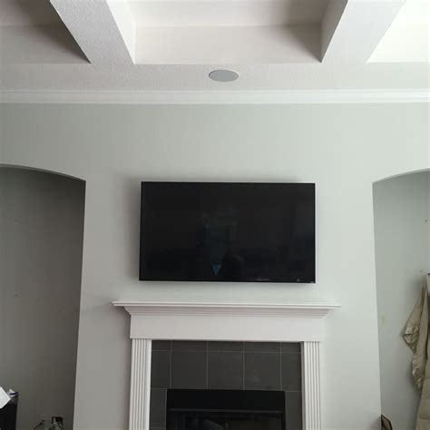 70 inch tv mounted on a tilt bracket | Tv mounted, Wall design, Design