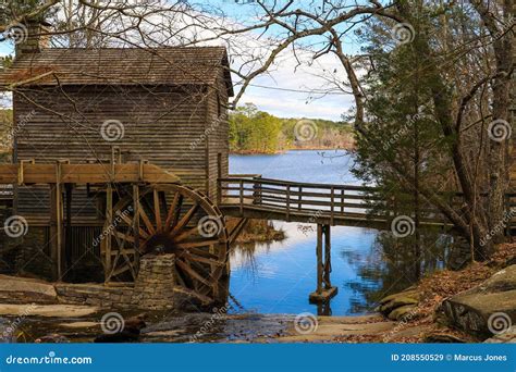 A Breathtaking Shot Of The Old Wooden Grist Water Mill At Stone