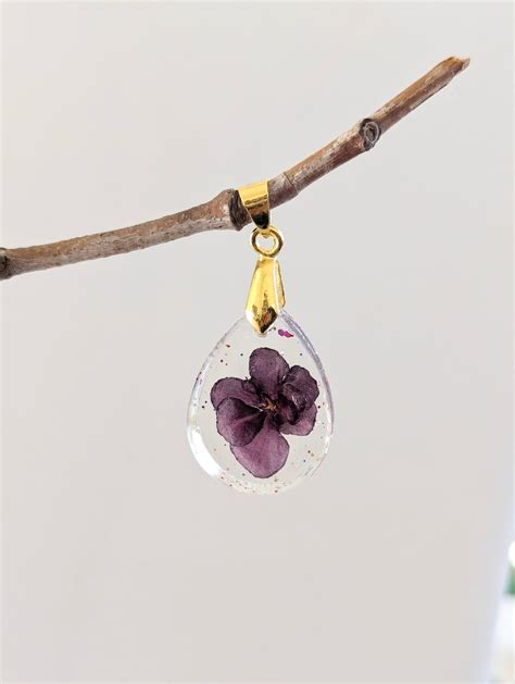 real red african violet flower preserved   pretty resin pendant