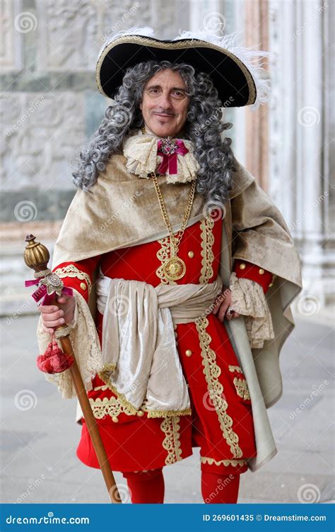 A Man In A Carnival Costume In San Marco Square Italy Venice Carnival