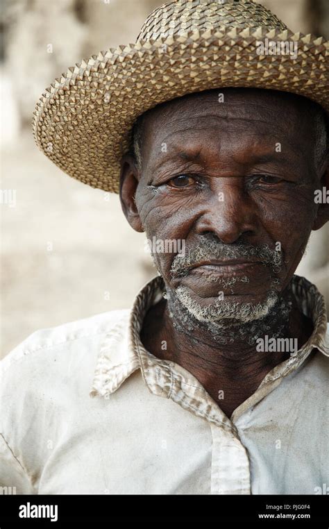 A portrait of an elderly Haitian man unable to make eye contact in ...